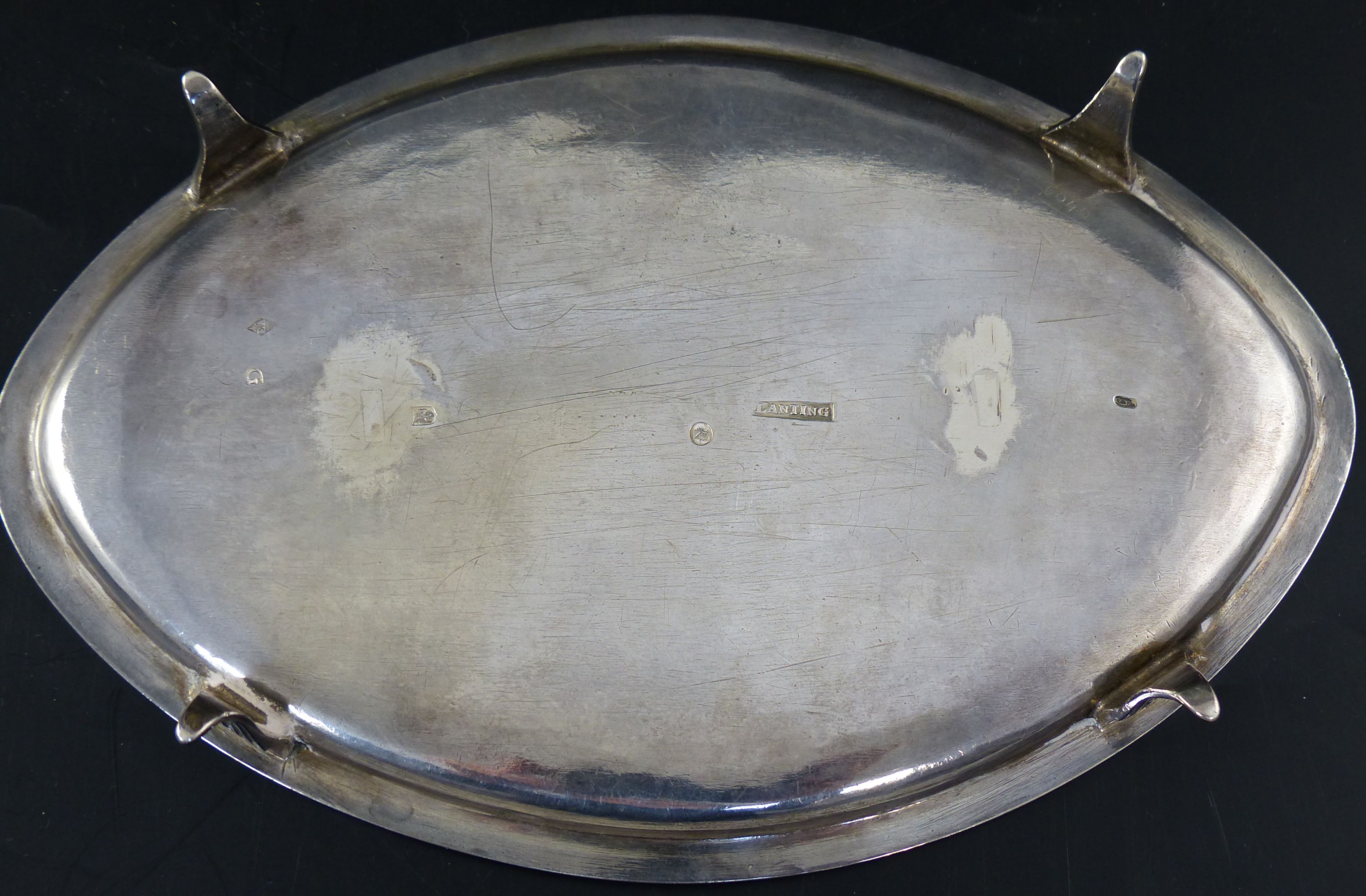 A 19th century Dutch white metal navette shaped teapot stand with engraved presentation inscription